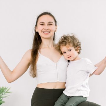 smiling-sporty-mother-and-son-practicing-yoga-tree-2023-11-27-05-05-51-utc-1.jpg